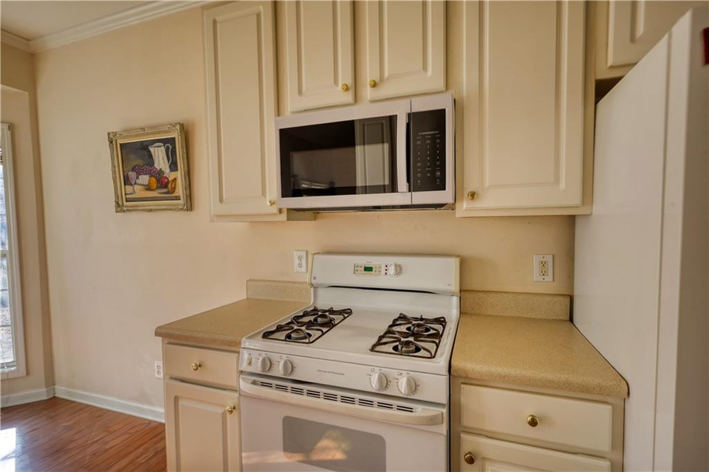 2648 Neighborhood Walk Villa Rica, GA 30180 - Photo 19 of 40 a stove top oven sitting inside of a kitchen
