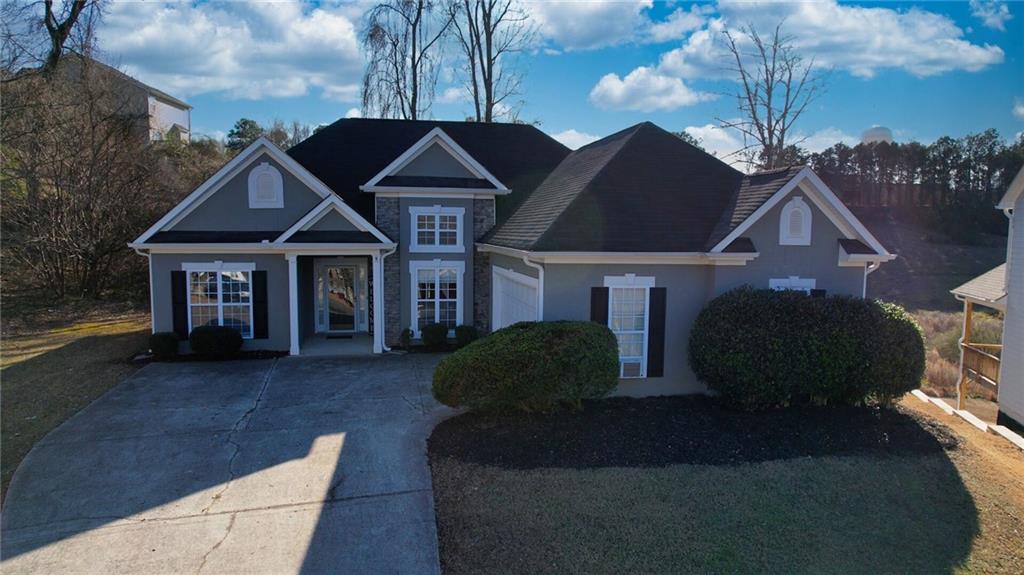 2648 Neighborhood Walk Villa Rica, GA 30180 - Photo 2 of 40 a front view of a house with garden