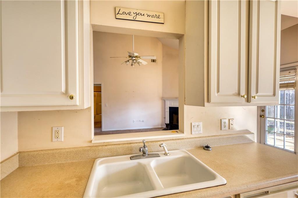 2648 Neighborhood Walk Villa Rica, GA 30180 - Photo 22 of 40 a bathroom with a sink and a mirror
