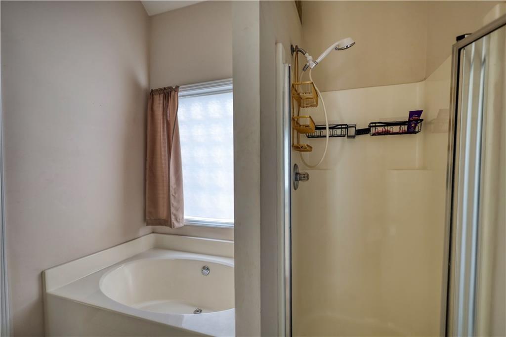 2648 Neighborhood Walk Villa Rica, GA 30180 - Photo 26 of 40 a bathroom with a bathtub