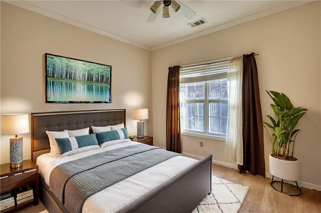 2648 Neighborhood Walk Villa Rica, GA 30180 - Photo 29 of 40 a bedroom with bed and window