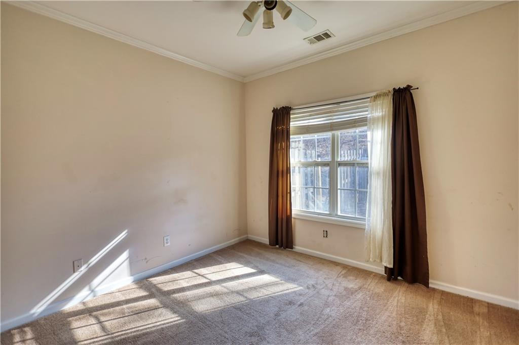 2648 Neighborhood Walk Villa Rica, GA 30180 - Photo 30 of 40 a view of an empty room with a window