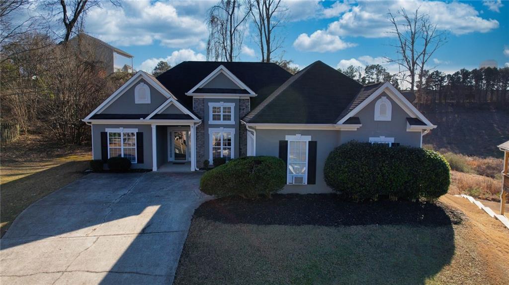 2648 Neighborhood Walk Villa Rica, GA 30180 - Photo 3 of 40 a front view of a house with garden