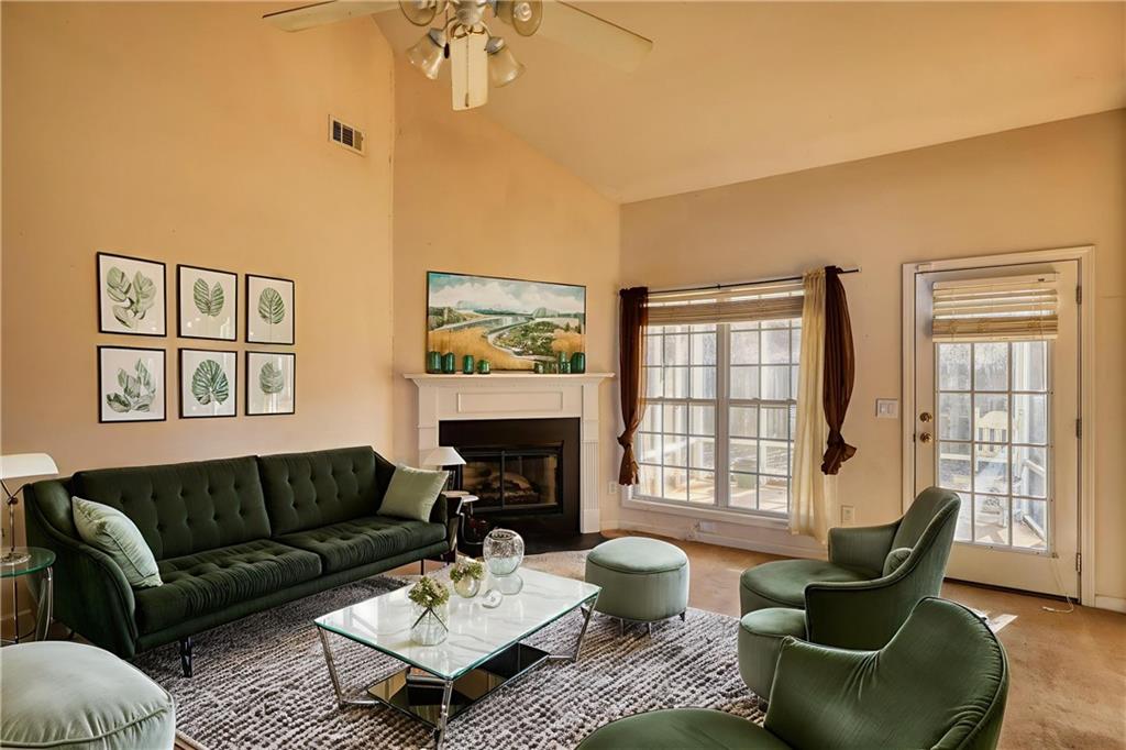 2648 Neighborhood Walk Villa Rica, GA 30180 - Photo 6 of 40 a living room with furniture a table and a large window
