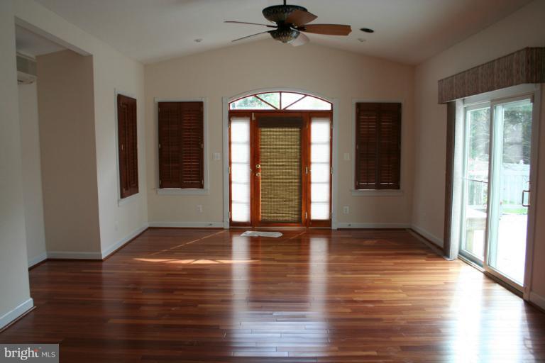 9303 Sandra Park Road Perry Hall, MD 21128 - Photo 11 of 25 a view of an empty room with window and wooden floor