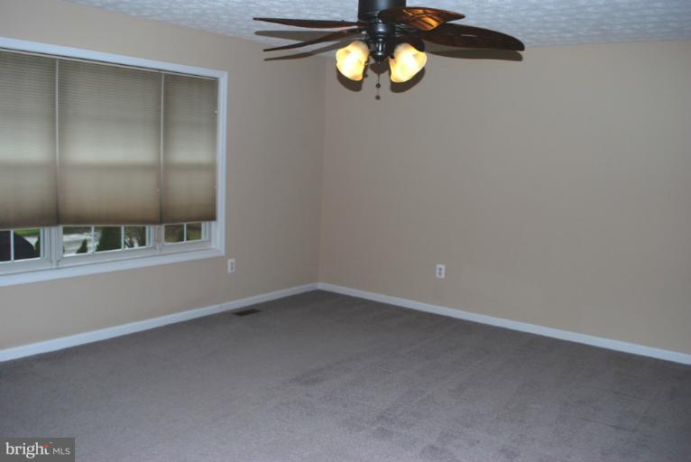 9303 Sandra Park Road Perry Hall, MD 21128 - Photo 12 of 25 a view of an empty room with a window