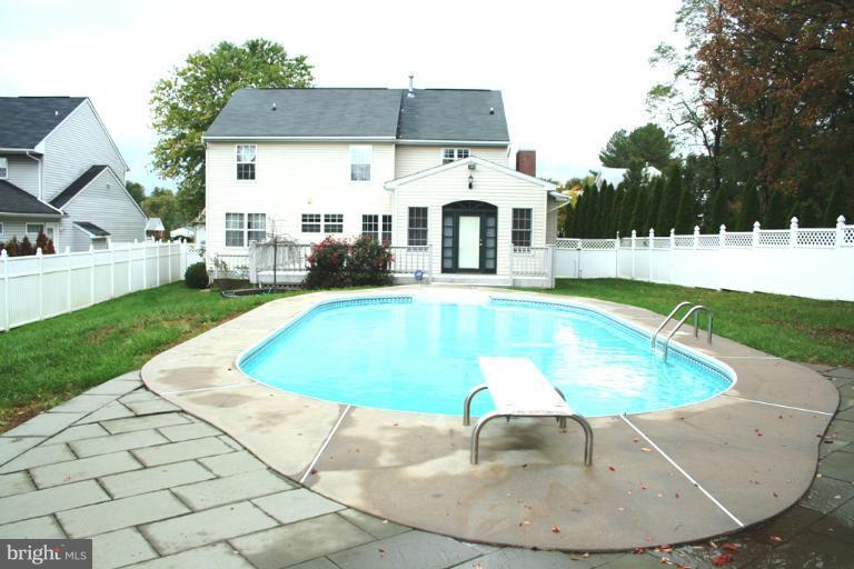 9303 Sandra Park Road Perry Hall, MD 21128 - Photo 13 of 25 a view of a white house with a swimming pool