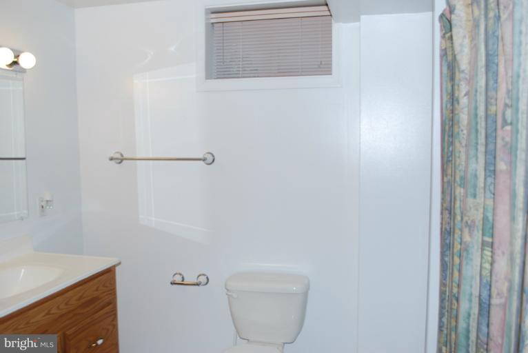 9303 Sandra Park Road Perry Hall, MD 21128 - Photo 15 of 25 a bathroom with a toilet and a sink