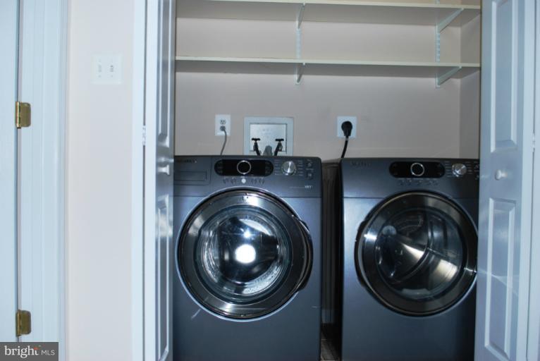9303 Sandra Park Road Perry Hall, MD 21128 - Photo 16 of 25 a view of a storage & utility room with dryer and washer