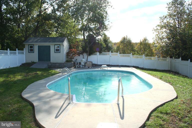 9303 Sandra Park Road Perry Hall, MD 21128 - Photo 5 of 25 a view of a swimming pool with a yard