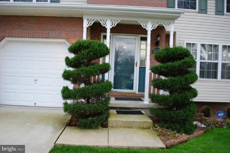 9303 Sandra Park Road Perry Hall, MD 21128 - Photo 9 of 25 a front view of a house with garden