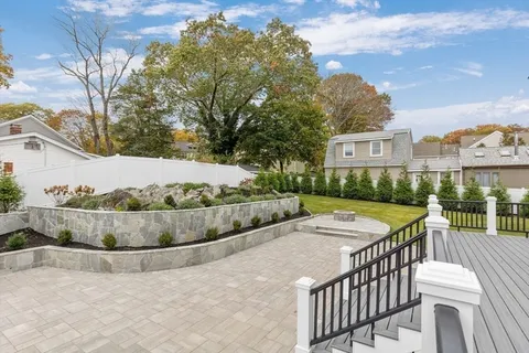 an aerial view of a house with a yard pool patio and outdoor seating