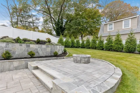 a spacious bedroom with a bed and glass door