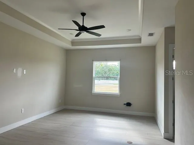 a view of a bathroom with a shower and a sink