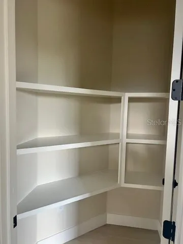 a view of a livingroom with kitchen