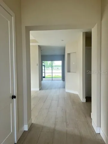 a view of an entryway of a room and a livingroom