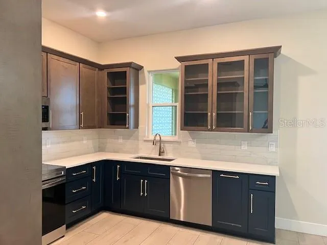 a kitchen with a sink and a window