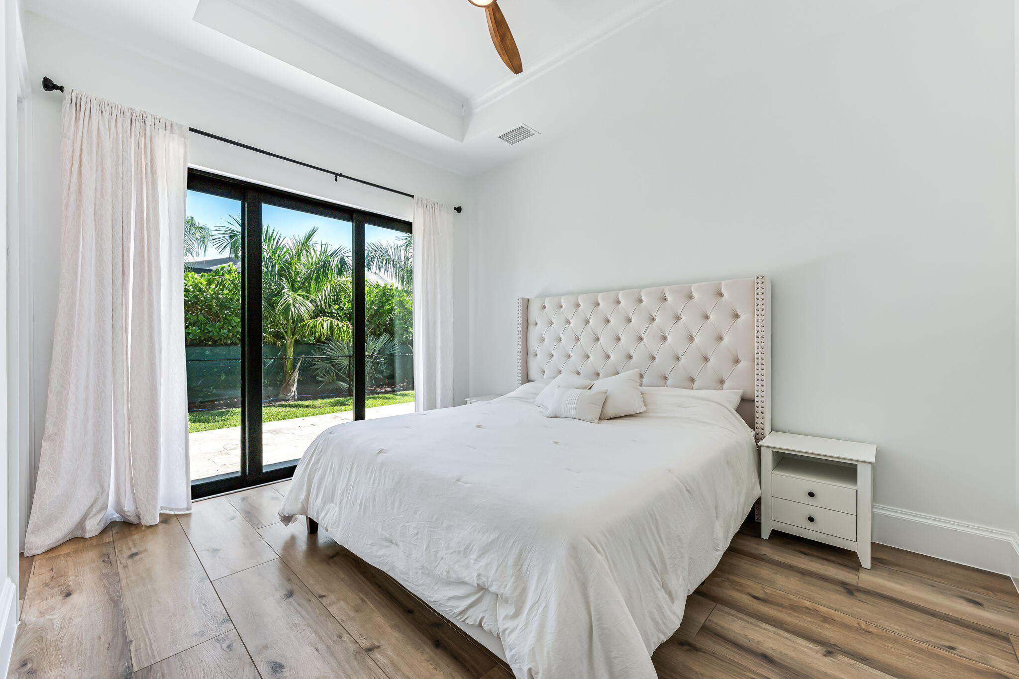 1362 San Marco Road Marco Island, FL 34145 - Photo 24 of 45 a bedroom with a bed and a large window