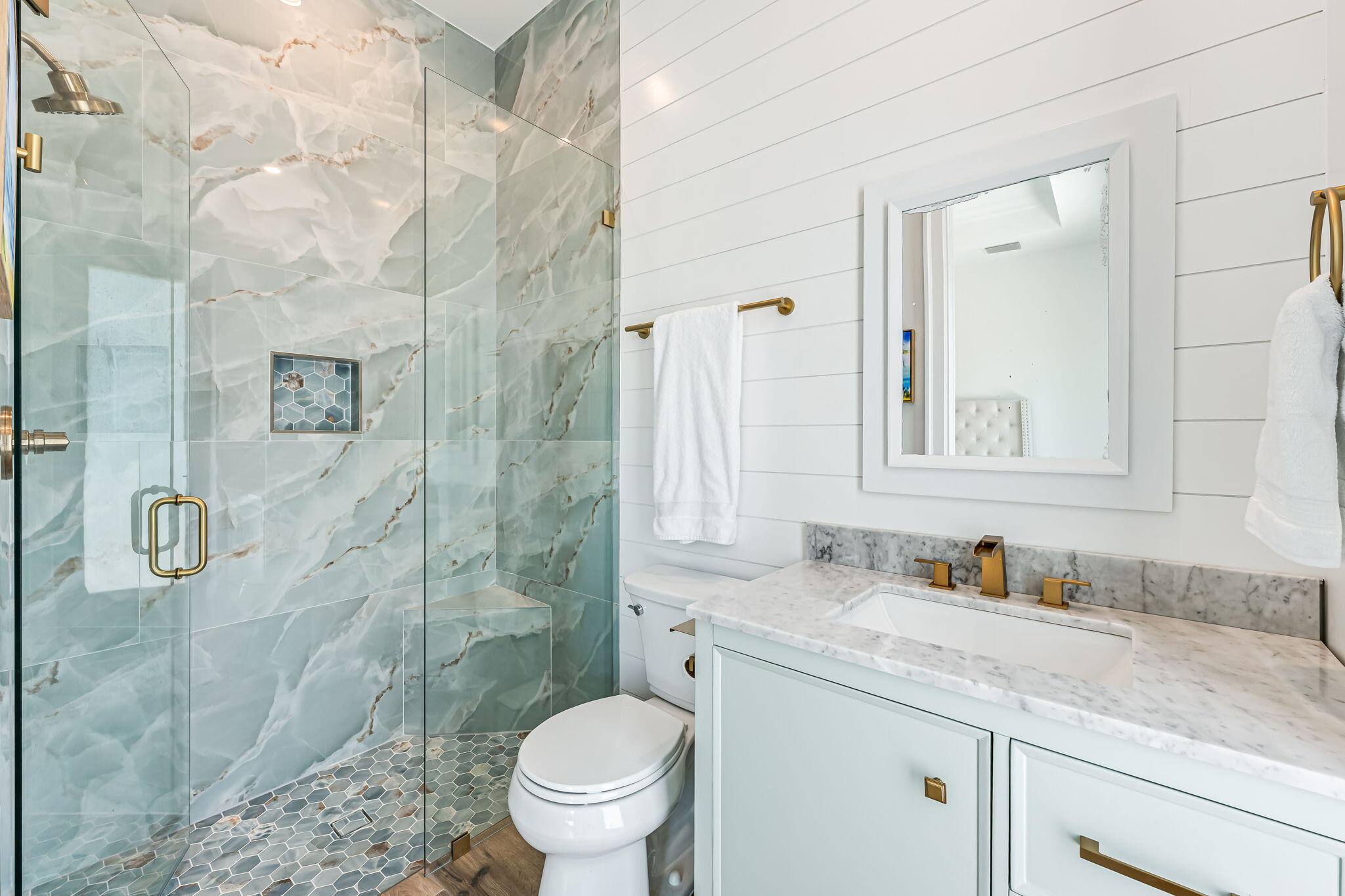 1362 San Marco Road Marco Island, FL 34145 - Photo 25 of 45 a bathroom with a granite countertop sink a toilet and shower