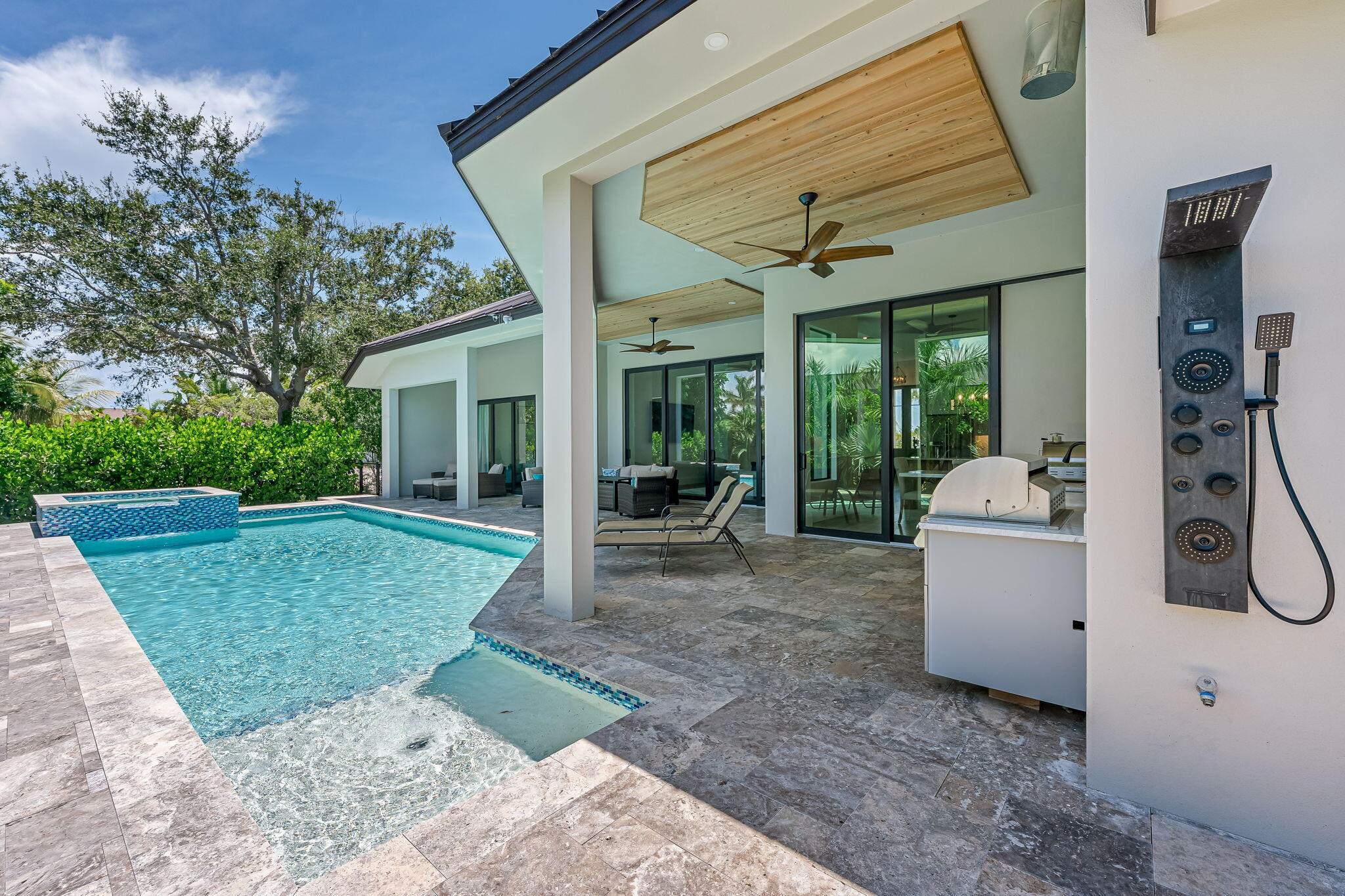 1362 San Marco Road Marco Island, FL 34145 - Photo 39 of 45 a view of a white house with a patio and a yard