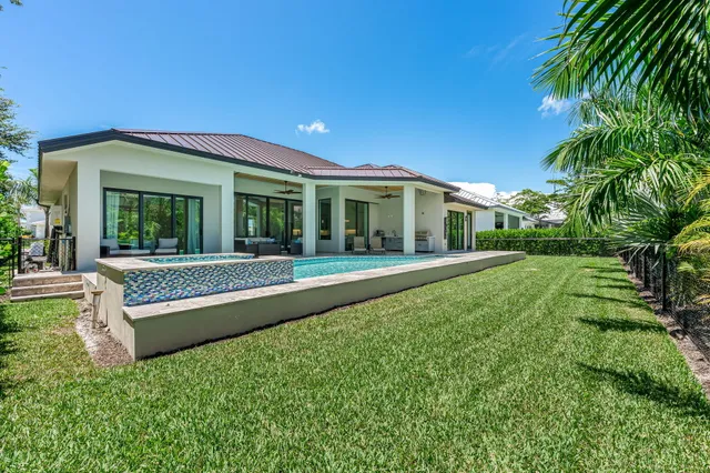 a view of house with a yard