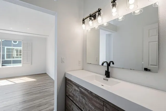 a bathroom with a sink and a mirror