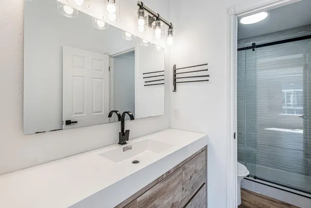 a bathroom with a sink and a mirror