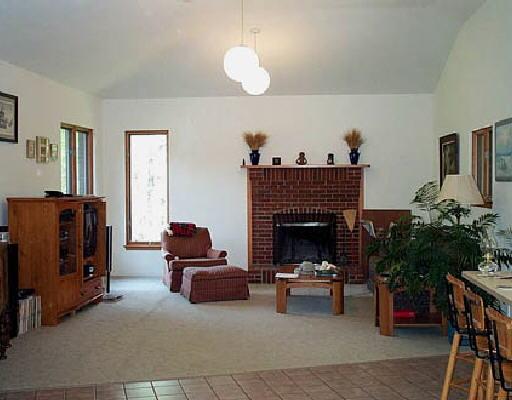 536 Wild Cherry Road Northeast Pilot, VA 24138 - Photo 3 of 5 a living room with furniture and a fireplace