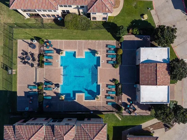 a view of a dining room with furniture and a potted plant