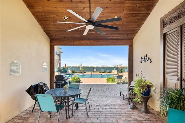 a view of a swimming pool with a patio