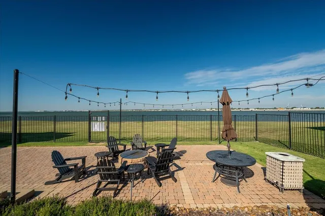 a view of a house with pool and lake view