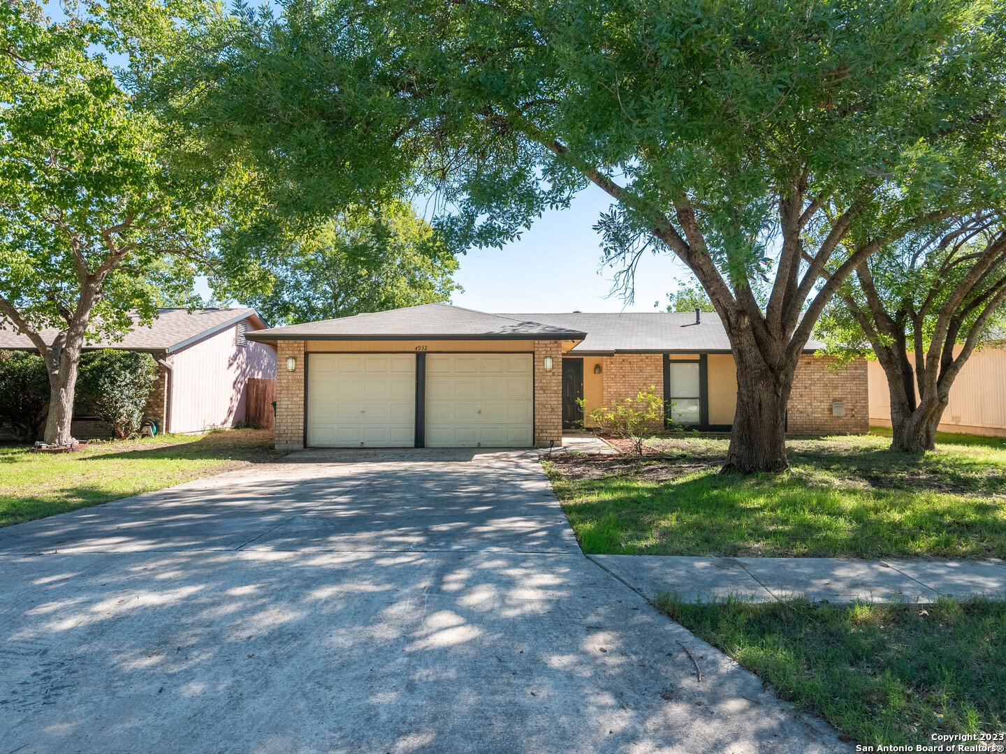 4932 Champlain San Antonio, TX 78217 - Photo 1 of 1 a view of a house with backyard and a tree