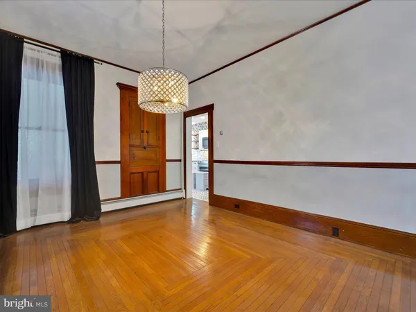a view of entryway with wooden floor