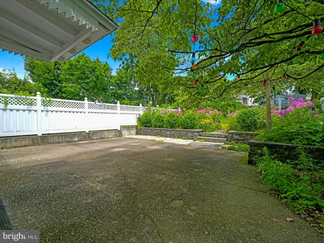 a view of a house with a tree