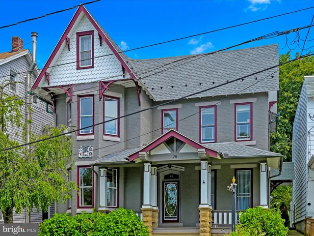 a front view of a house with yard