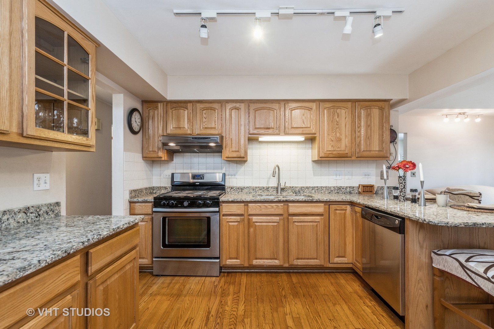 873 Barlina Road Crystal Lake, IL 60014 - Photo 11 of 24 a kitchen with stainless steel appliances granite countertop a stove and a sink
