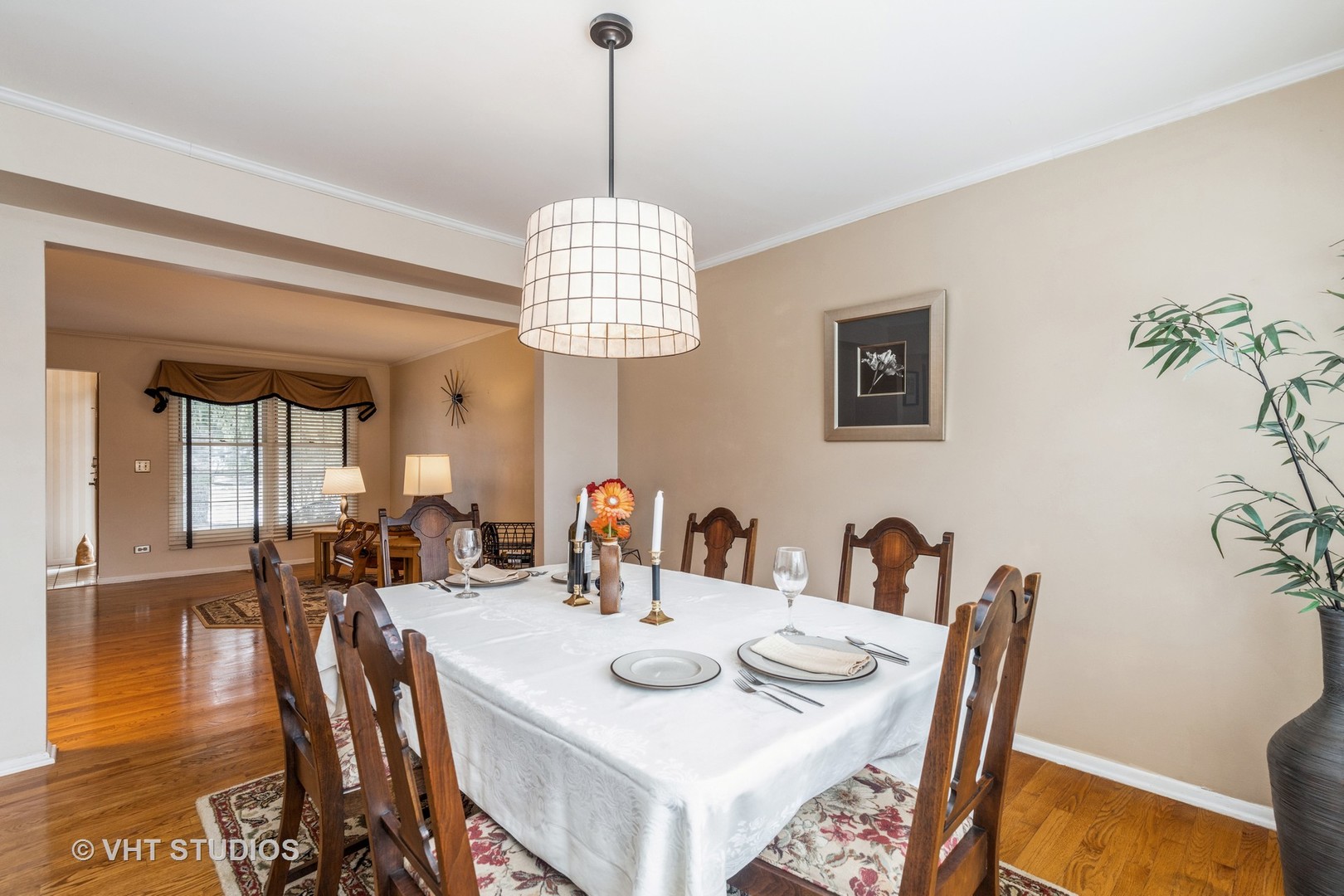 873 Barlina Road Crystal Lake, IL 60014 - Photo 5 of 24 a view of a dining room with furniture wooden floor and chandelier