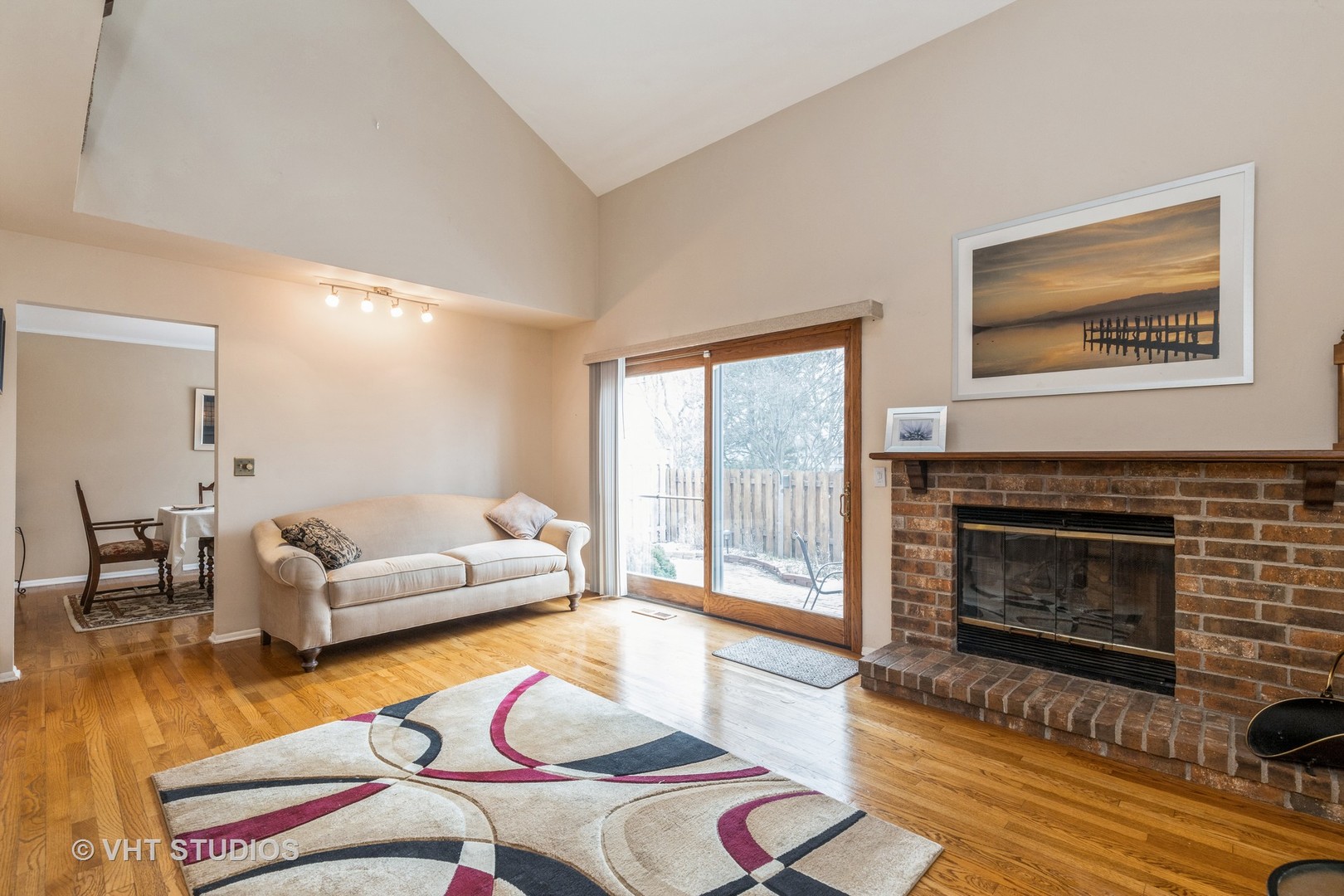873 Barlina Road Crystal Lake, IL 60014 - Photo 8 of 24 a living room with furniture and a fireplace