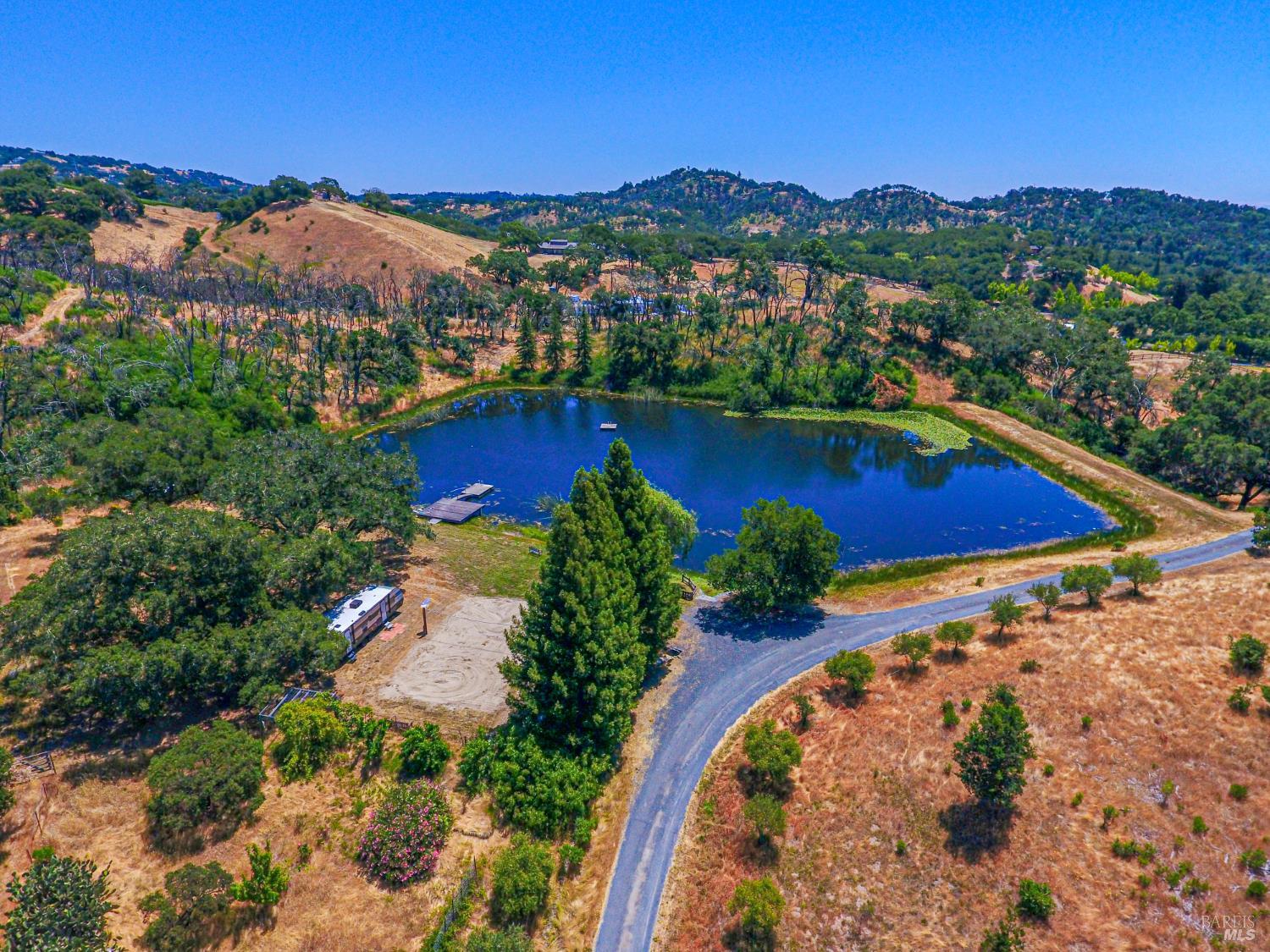 9110 Chalk Hill Road Healdsburg, CA 95448 - Photo 13 of 59 Just around the corner you come upon an enchanted pond enhanced by boat and swimming docks.
