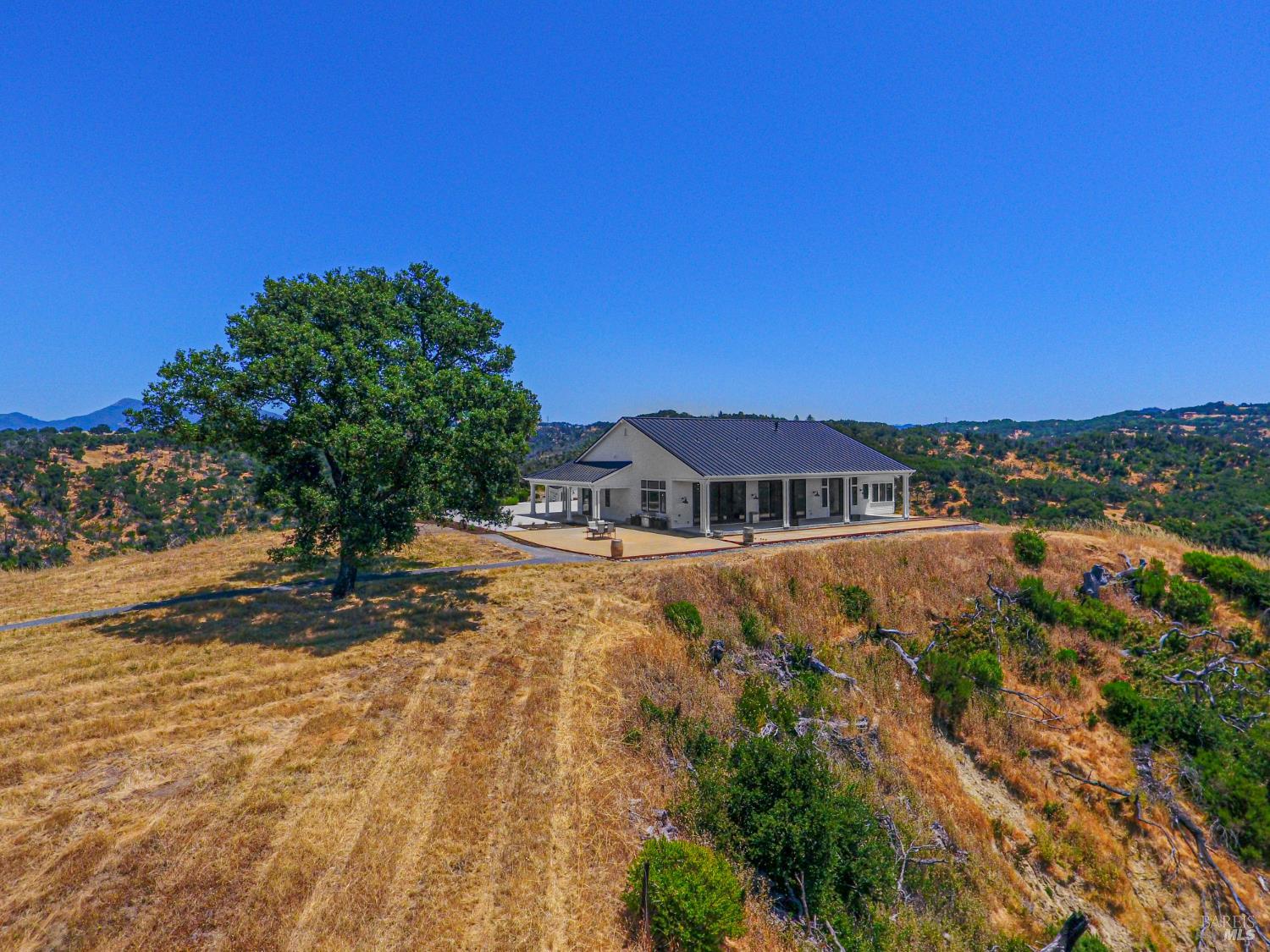 9110 Chalk Hill Road Healdsburg, CA 95448 - Photo 10 of 59 Main House with Covered Seating Area for Conversing or Enjoying the Solitude and the Views