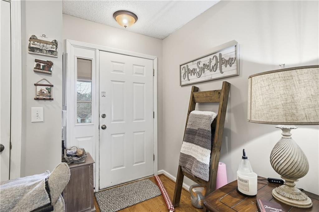 291 Buck Boulevard Southeast Calhoun, GA 30701 - Photo 15 of 32 a bedroom with furniture and wooden floor