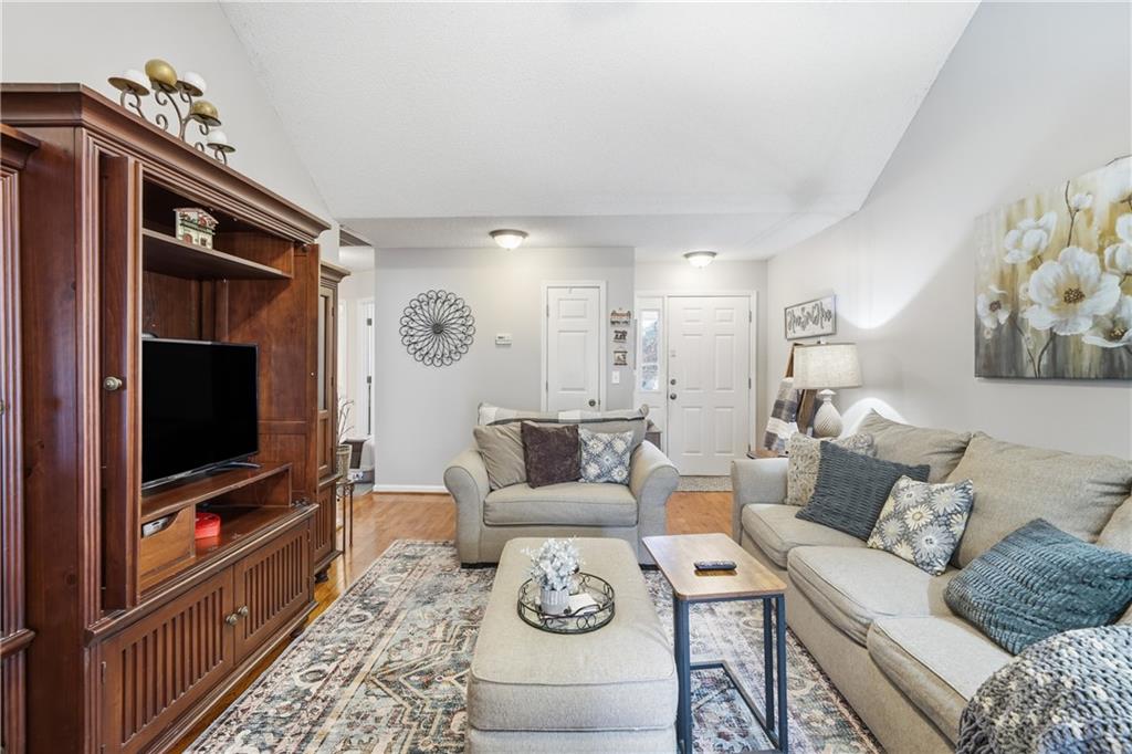 291 Buck Boulevard Southeast Calhoun, GA 30701 - Photo 16 of 32 a living room with furniture and a flat screen tv