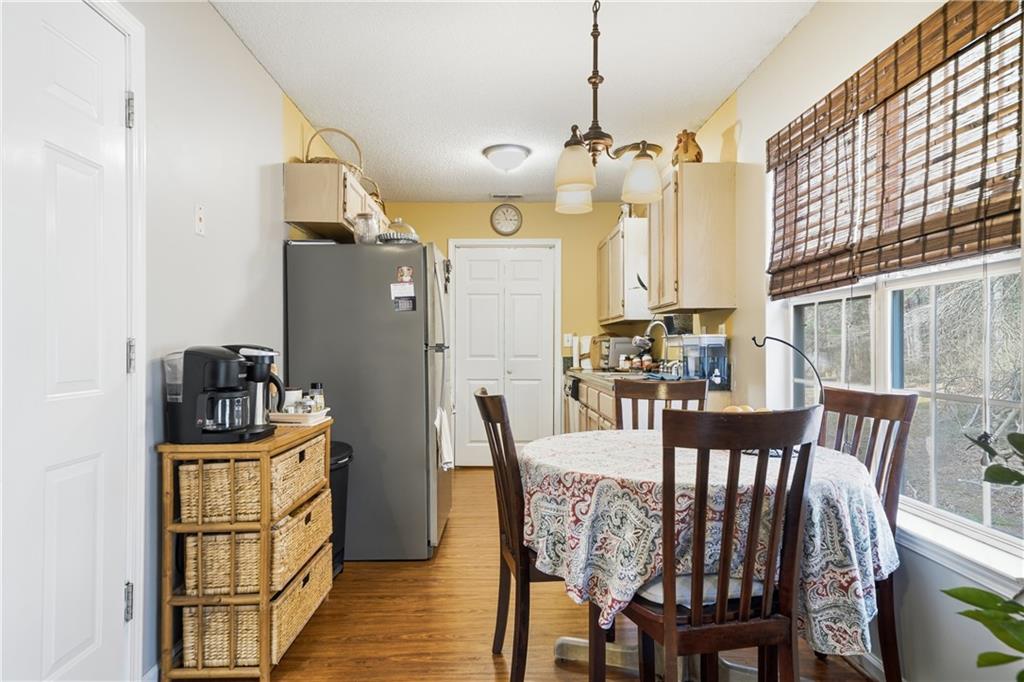 291 Buck Boulevard Southeast Calhoun, GA 30701 - Photo 21 of 32 a view of a dining room with furniture window and wooden floor