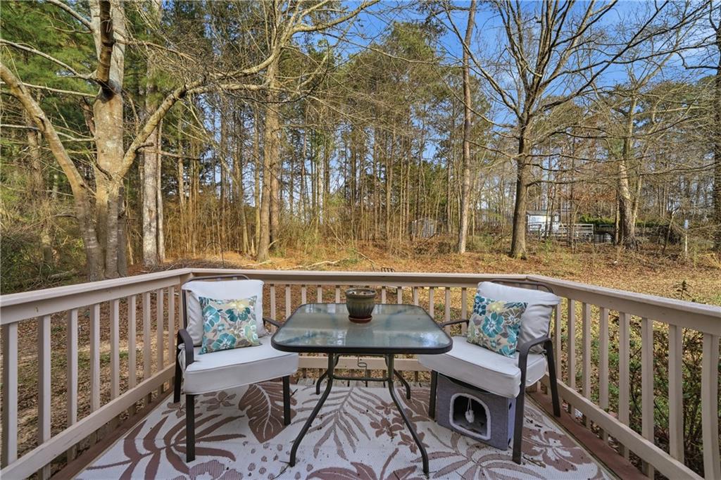 291 Buck Boulevard Southeast Calhoun, GA 30701 - Photo 26 of 32 a view of a chairs and table on the deck