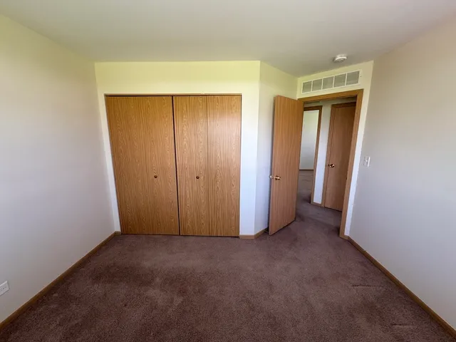 a view of hallway with closet area