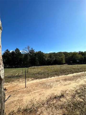 a view of a swimming pool with a lake view