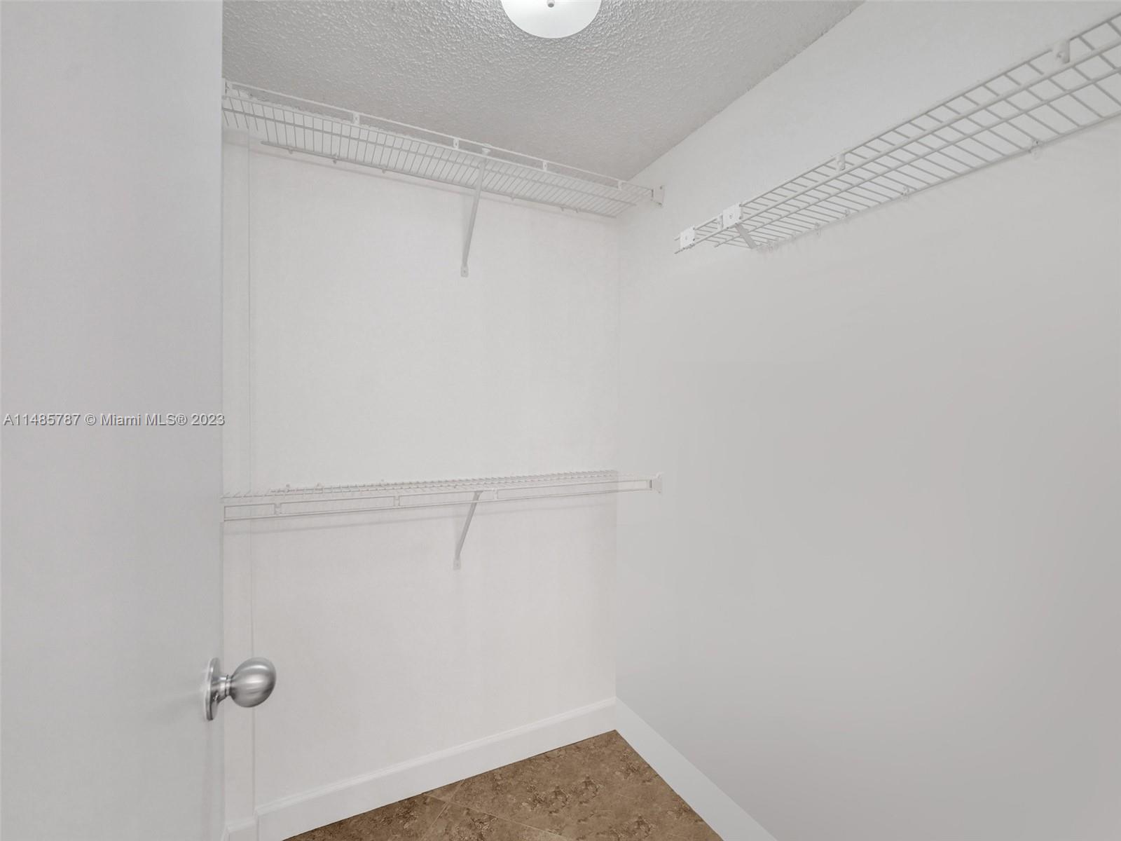 6339 La Costa Drive, Unit C Boca Raton, FL 33433 - Photo 17 of 23 a view of a room with racks on the wall