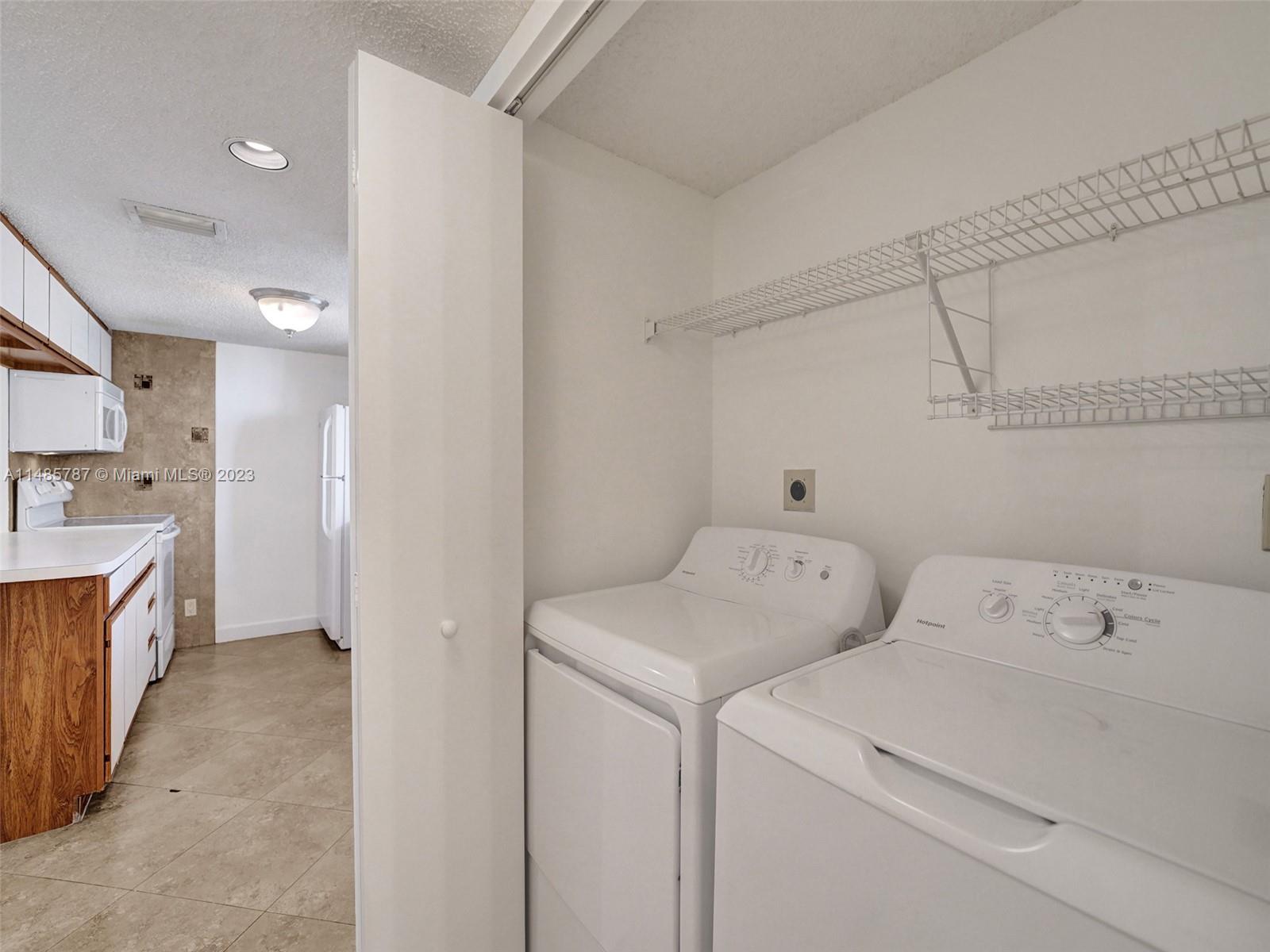 6339 La Costa Drive, Unit C Boca Raton, FL 33433 - Photo 19 of 23 a view of utility room with washer and dryer