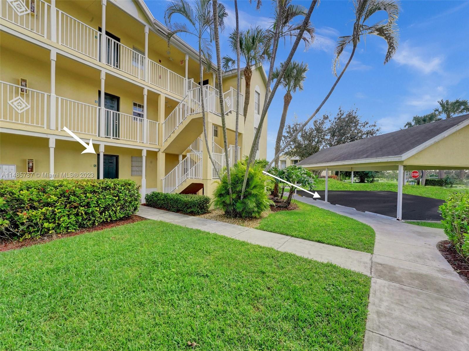 6339 La Costa Drive, Unit C Boca Raton, FL 33433 - Photo 2 of 23 a view of building with garden