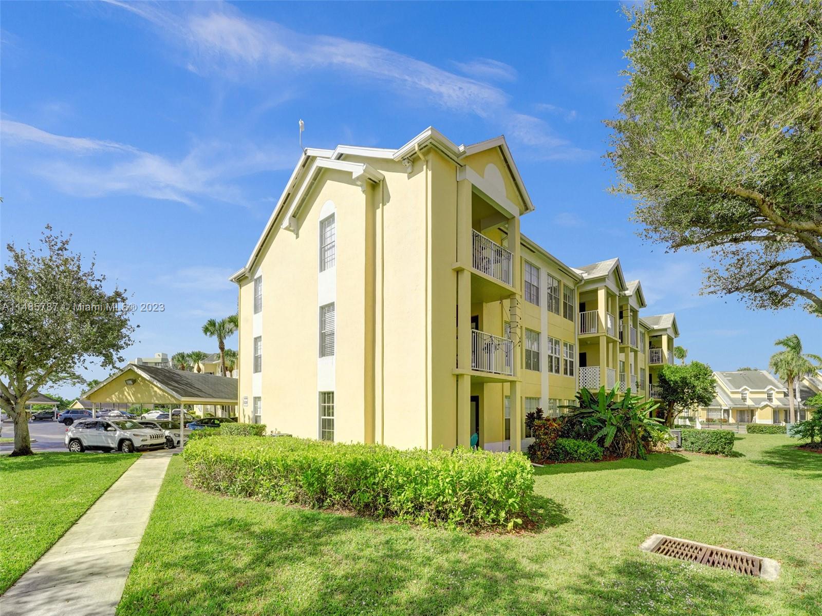6339 La Costa Drive, Unit C Boca Raton, FL 33433 - Photo 23 of 23 a view of a building with a yard